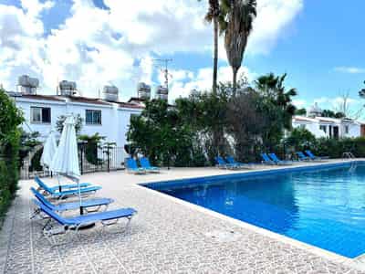 Complex of townhouses with a garden and a swimming pool at 300 meters from the sea, Paphos, Cyprus