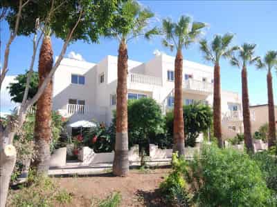 Complex of townhouses with a garden and a swimming pool at 300 meters from the sea, Paphos, Cyprus