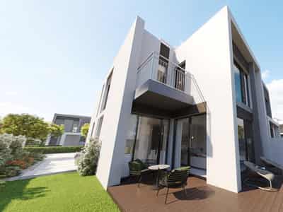 Gated complex of townhouses Cherrywoods with a swimming pool, schools and restaurants, Dubailand, Dubai, UAE