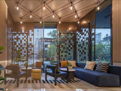 High-rise residence with a swimming pool and lounge areas in a posh neighborhood of Bangkok, Thailand