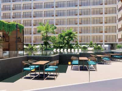 Modern residential complex with a large swimming pool opposite a shopping center in Chalong, Phuket, Thailand