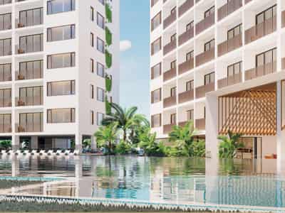Modern residential complex with a large swimming pool opposite a shopping center in Chalong, Phuket, Thailand