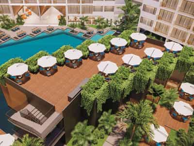 Modern residential complex with a large swimming pool opposite a shopping center in Chalong, Phuket, Thailand