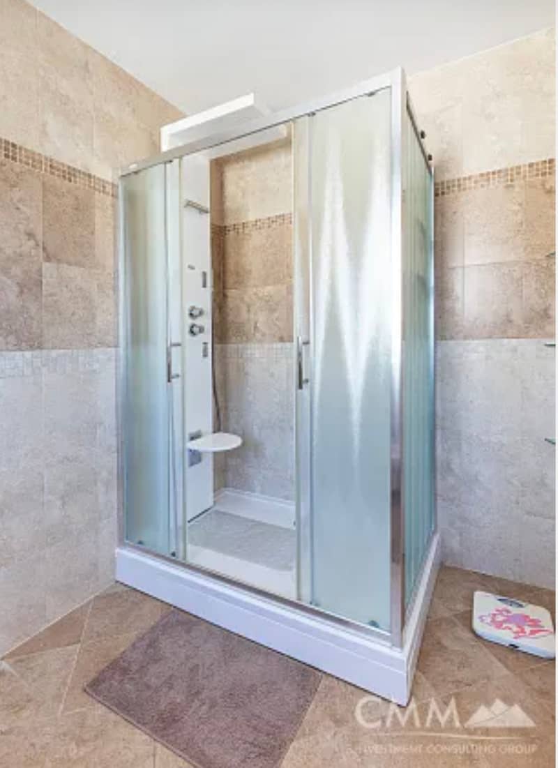 Spacious two-level apartment with sea view in Sveti Stefan — photo 28