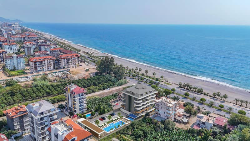 Новый жилой комплекс с бассейнами, спортзалом и паркингом на берегу моря, Кестель, Алания, Турция — фото 2