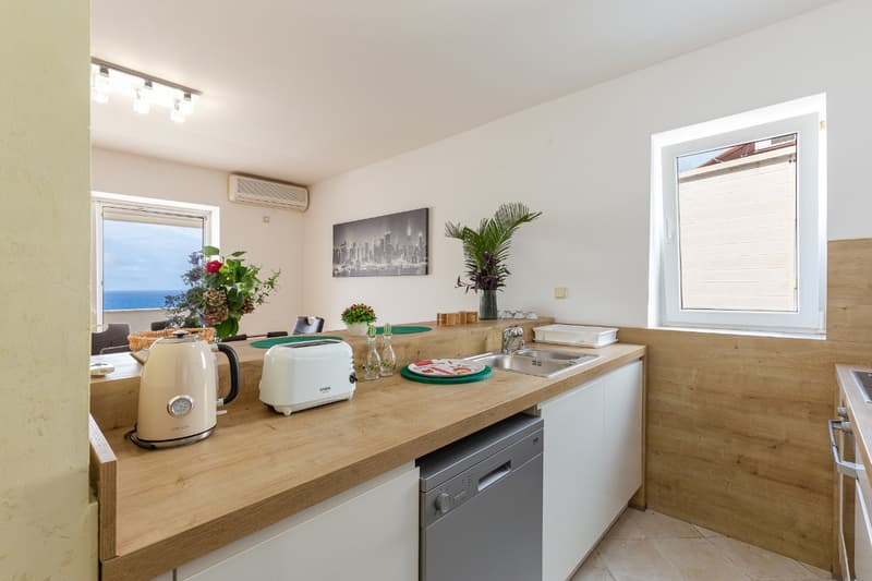 Spacious two-level apartment with sea view in Sveti Stefan — photo 1
