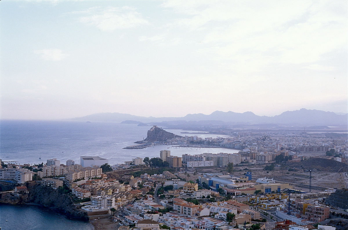 Typical coastal buildings and the historic centre with port views