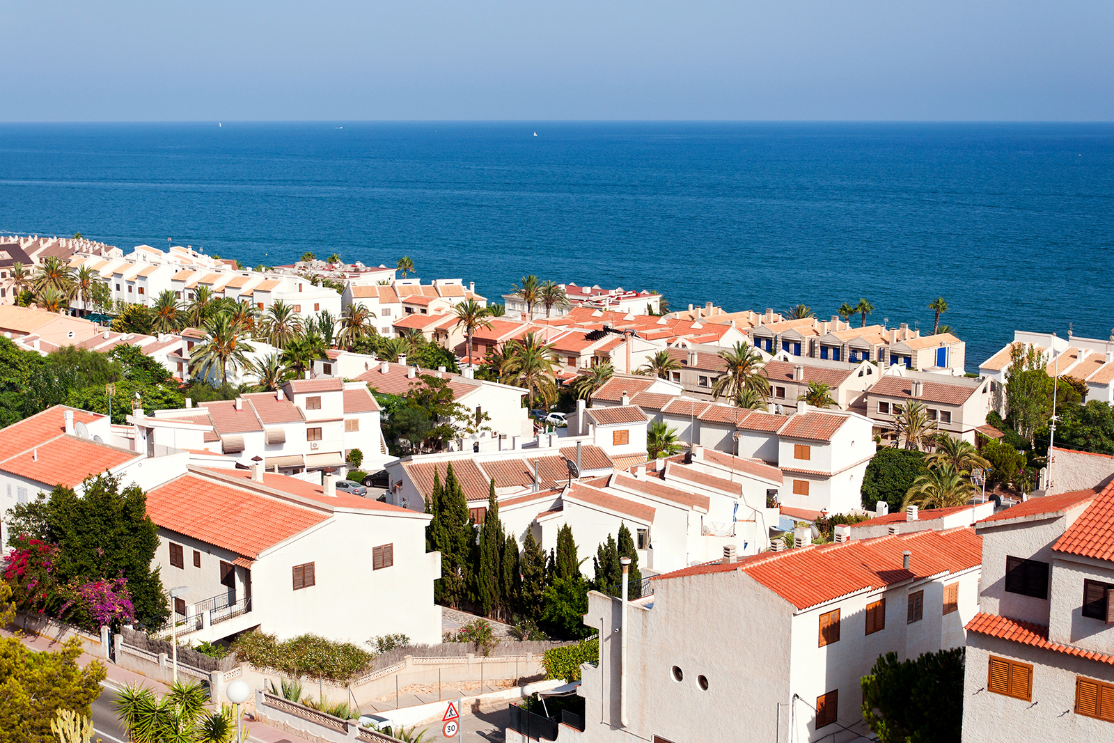 View of white houses by the sea in Santa Pola