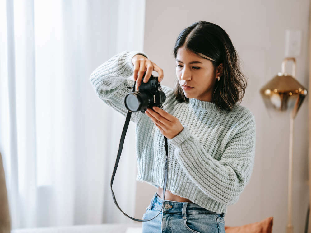 girl in room taking photo