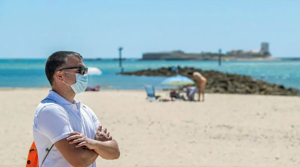Man in mask at the beach