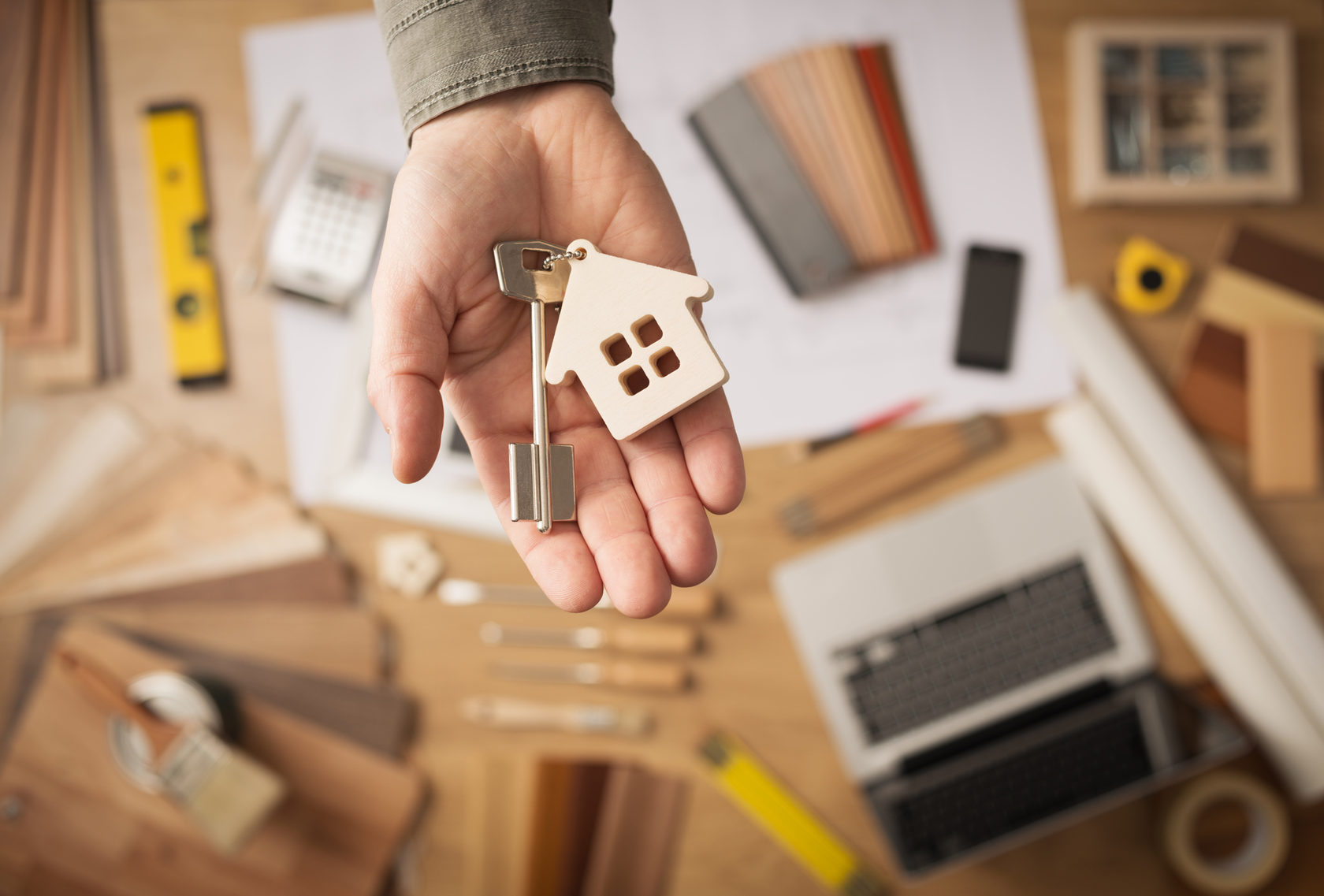 House-shaped keychain on a key