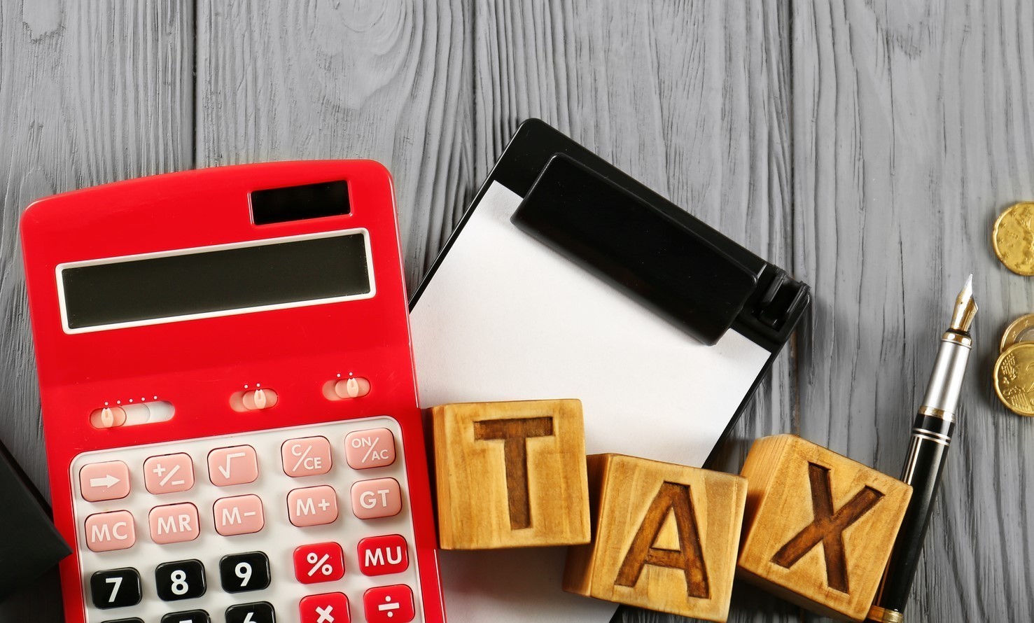 Calculator and wooden letters TAX